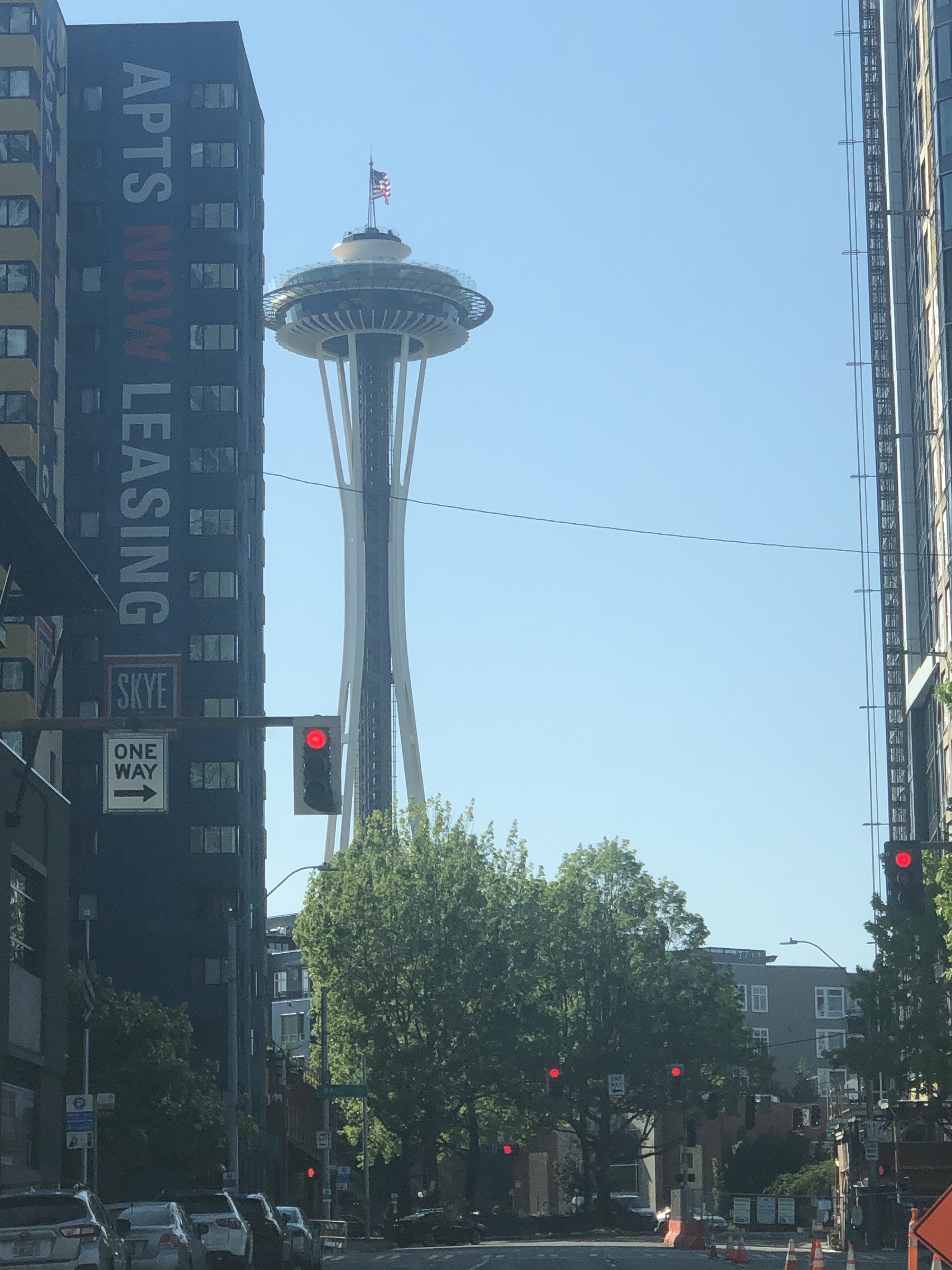 Picture of the space needle taken from the streets of downtown Seattle